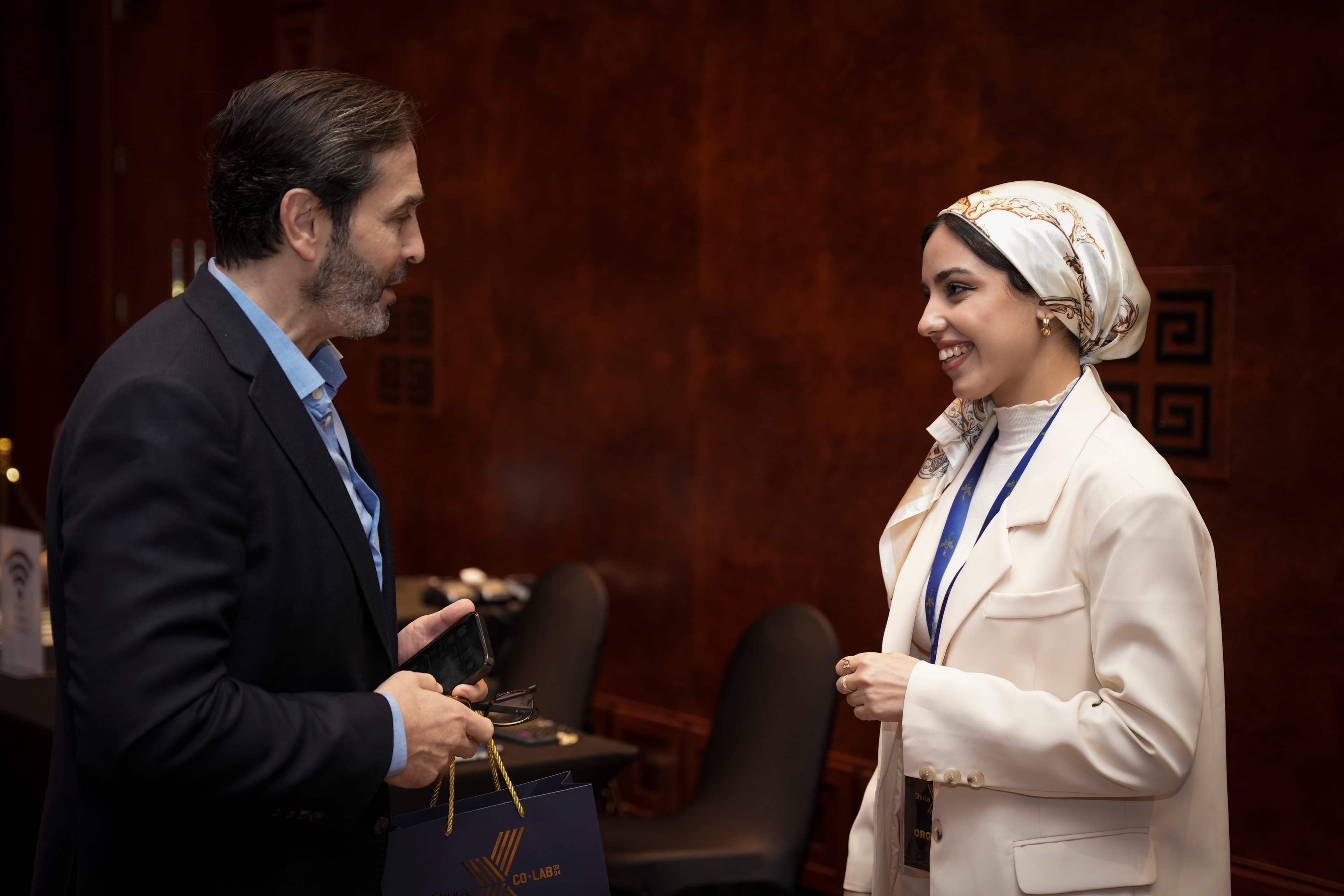 Ishraq Brahmi in conversation at a business event