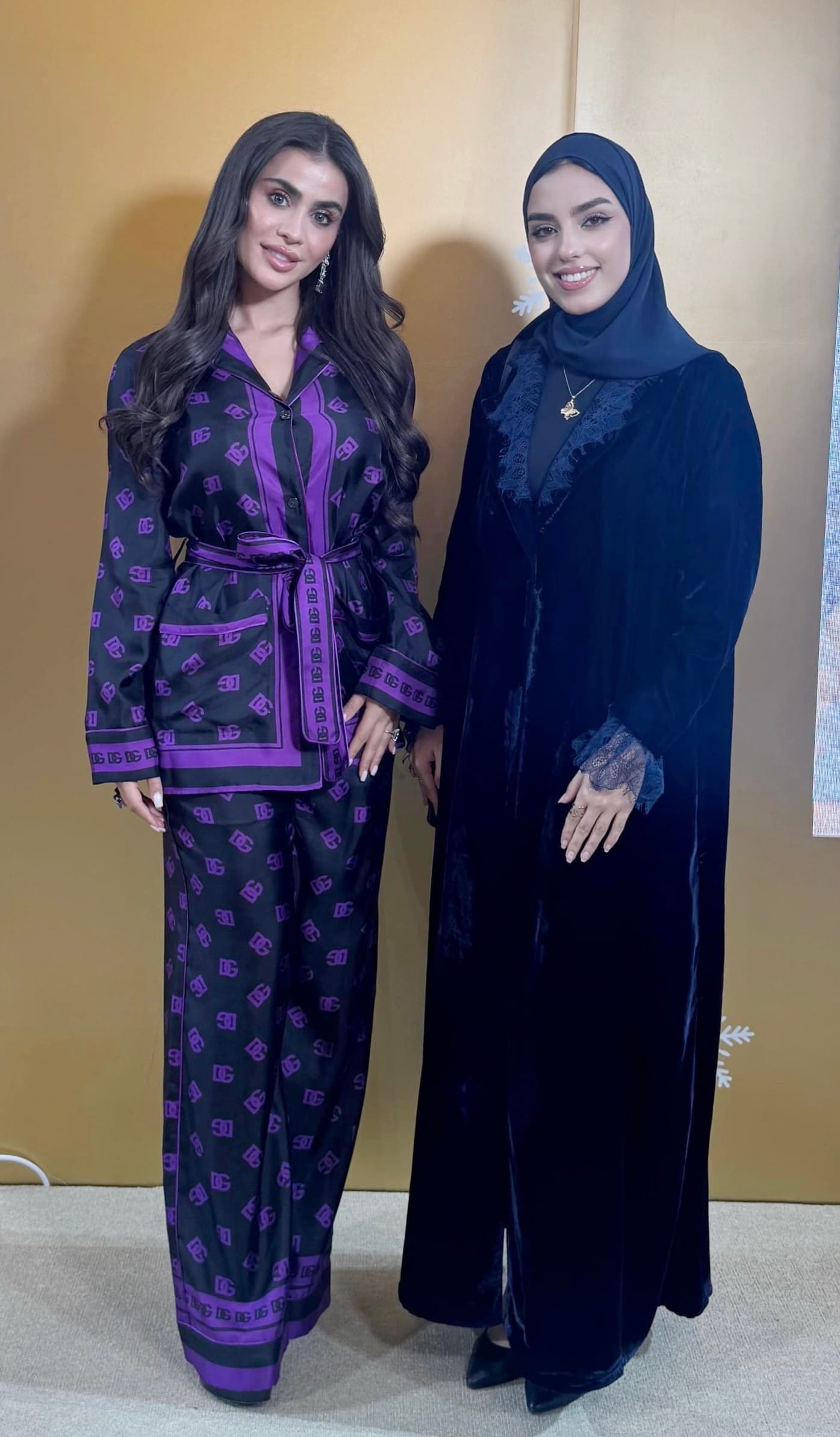 ISHRAQ BRAHMI photographed with another attendee at a gathering